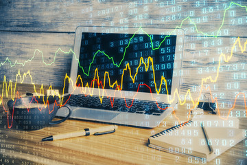 Multi exposure of chart and financial info and work space with computer background. Concept of international online trading.