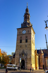 Fototapeta na wymiar Oslo Cathedral next to the historical Brannvakten (firehouse), Oslo, Norway