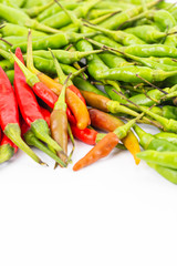 A set of fresh hot and spicy red and green bird-chilli on white space