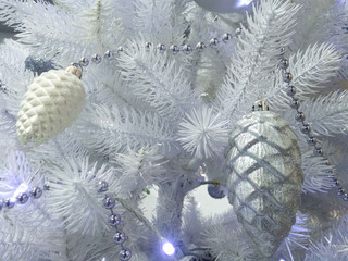 Christmas white tree with Christmas toys close up