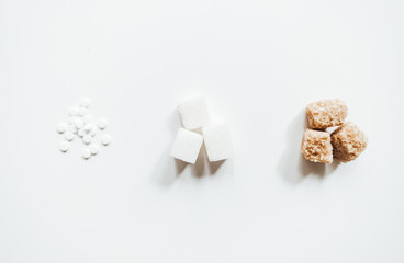 Different types of sugar with sugar substitute on a white background, copy space. Diabetic concept 