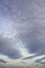 Evening cloudscape during sunset. Beautiful vertical background.