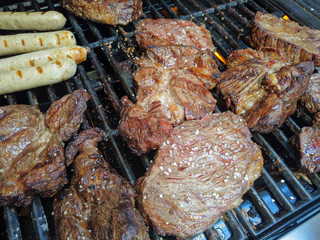 Grilling a piece of beef meat with friends on a bbq party grill delicioous fine food  barbecuing barbeque barbequing season seasonal super tasty stake stakes salt sausage sausages