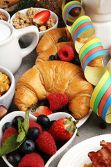 Breakfast served with coffee, orange juice, croissants, cereals and fruits. Balanced diet. Continental breakfast on carnival or new year