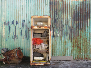 Best inside old rusty broken fridge. Martinique, French West Indies. Tropical culture