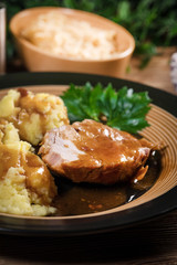 Braised pork neck in own sauce. Shallow depth of field.