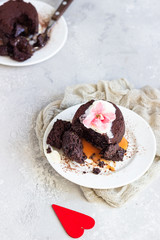 Warm dessert chocolate fondant with ice cream, mint and blackberry on the white plate. Lava cake...