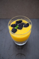 Chia pudding and Mango smoothie with blackberry topping