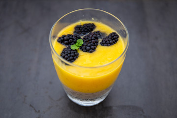Chia pudding and Mango smoothie with blackberry topping