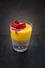 Chia pudding and Mango smoothie with raspberry topping