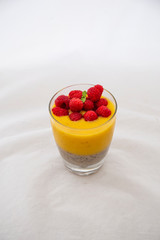 Chia pudding and Mango smoothie with raspberry topping