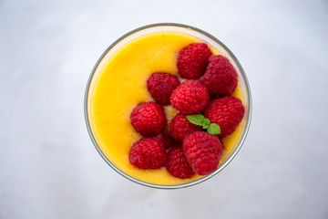 Chia pudding and Mango smoothie with raspberry topping