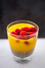 Chia pudding and Mango smoothie with raspberry topping
