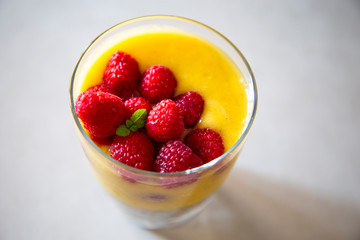 Chia pudding and Mango smoothie with raspberry topping
