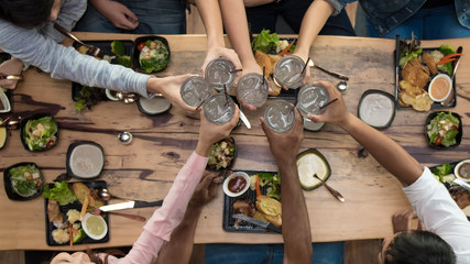 Celebration party, top view group of friends raising their glasses and making a toast, holidays,  holidays concept.