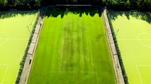 4K drone shooting on empty green stadium, stock video
