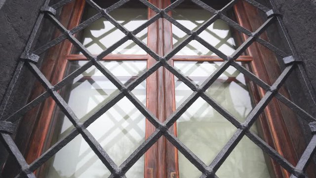 Old architectural window with a metal beautiful lattice, background, copy space