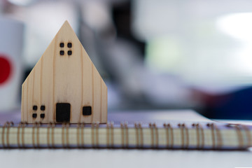 Mortgage loan and real estate property concept : Mortgage application form with black model wood...