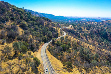 Fototapeta na wymiar Drone view, Route through Road Golden Gate National Recreation Area in San Francisco, United States