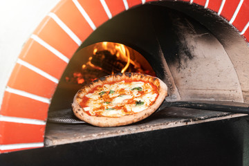 Pizza baking in the oven