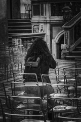 beautiful curly-haired woman photographed in church while praying