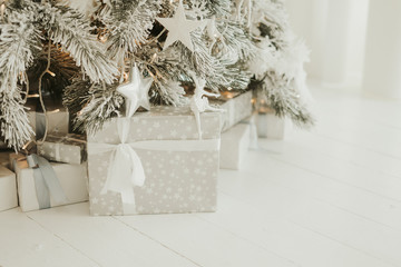 gray box with present under christmas tree. Presents and Gifts under Christmas Tree, Winter Holiday Concept