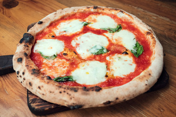 Freshly baked pizza on a wooden table