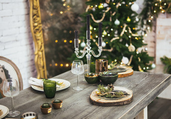 Christmas table setting. Holiday Decorations. Rustic table setting for Christmas eve