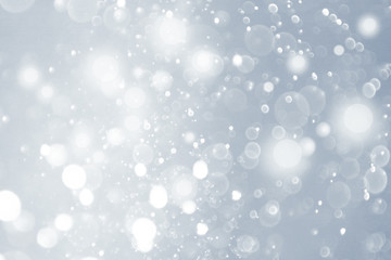 christmas background, bokeh and bright white lights. glitter lights background