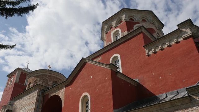 Beautiful red facade color of Zica monastery slow pan 4K video