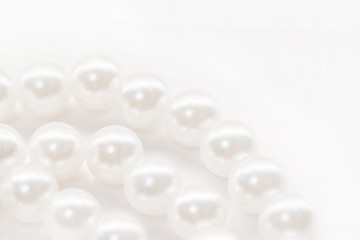 Fototapeta na wymiar Three pearl beads strings isolated white background
