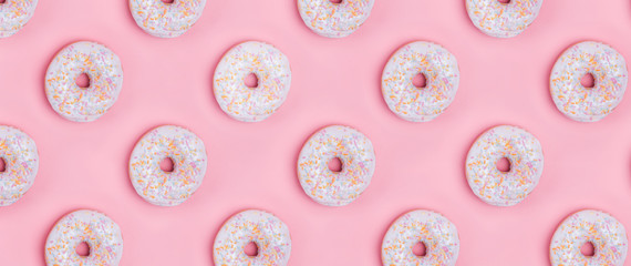 Creative background with delicious glazed donuts