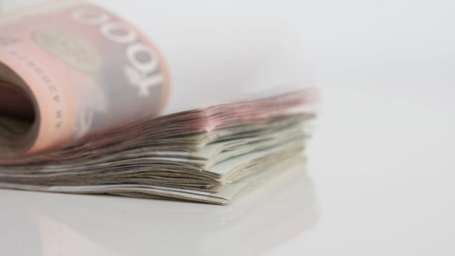 Counting banknotes of Serbian dinar on pile slow motion video
