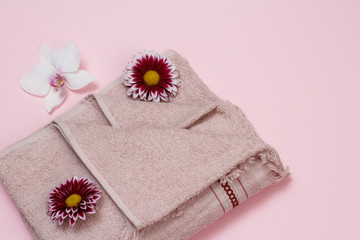 Soft terry towel with flowers on pink background.