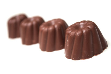 Group of Chocolates alignment in shaped kouglofs on white background