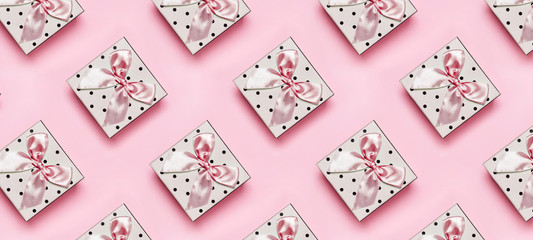 Giftboxes on pink background.