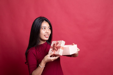 Young Asian woman open a gift box.