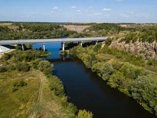 Fototapeta na wymiar Car bridge over river Sluch near Novograd Volynsky, Ukraine