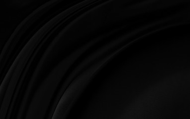 Black gray satin dark fabric texture luxurious shiny that is abstract silk cloth background with patterns soft waves blur beautiful.