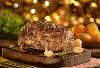 baked meat on a board on a holiday background