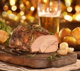 baked meat on a board on a holiday background