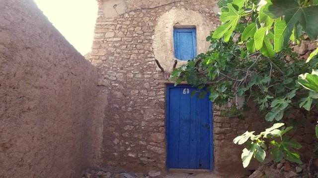 Blue door and window of an old Moroccan home in hoceima region.