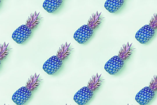 Food pattern with pineapples colored in blue color.