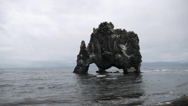 Hvitserkur Basalt Stack in Shallow Sea Water, Landmark of Iceland, Beach View on Gloomy Day