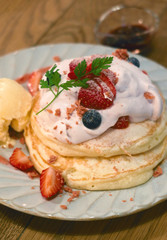 closeup delicious pancake with strawberry cream mousse