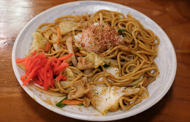 pork yakisoba noodle on wood table