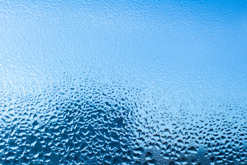 blue water drops on glass