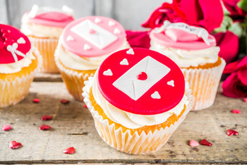 Valentine's day greeting card. Sweet Valentine's creative dessert food. Homemade pink and red  delicious cupcakes with decor of Valentine day symbols