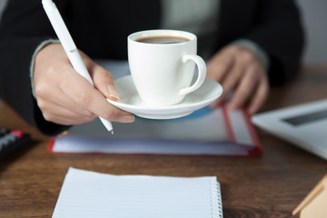woman hand cup of coffee