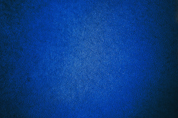 Old aged suede leather background with coarse texture classic blue color gradient backdrop wallpaper